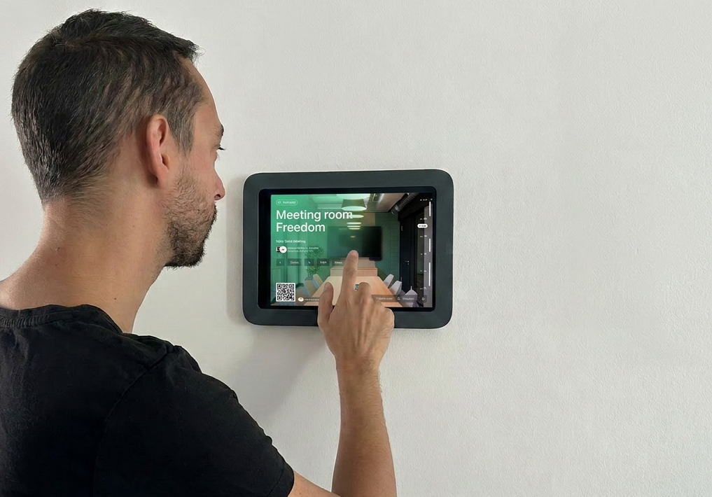Archie room booking tablet mounted outside a meeting room